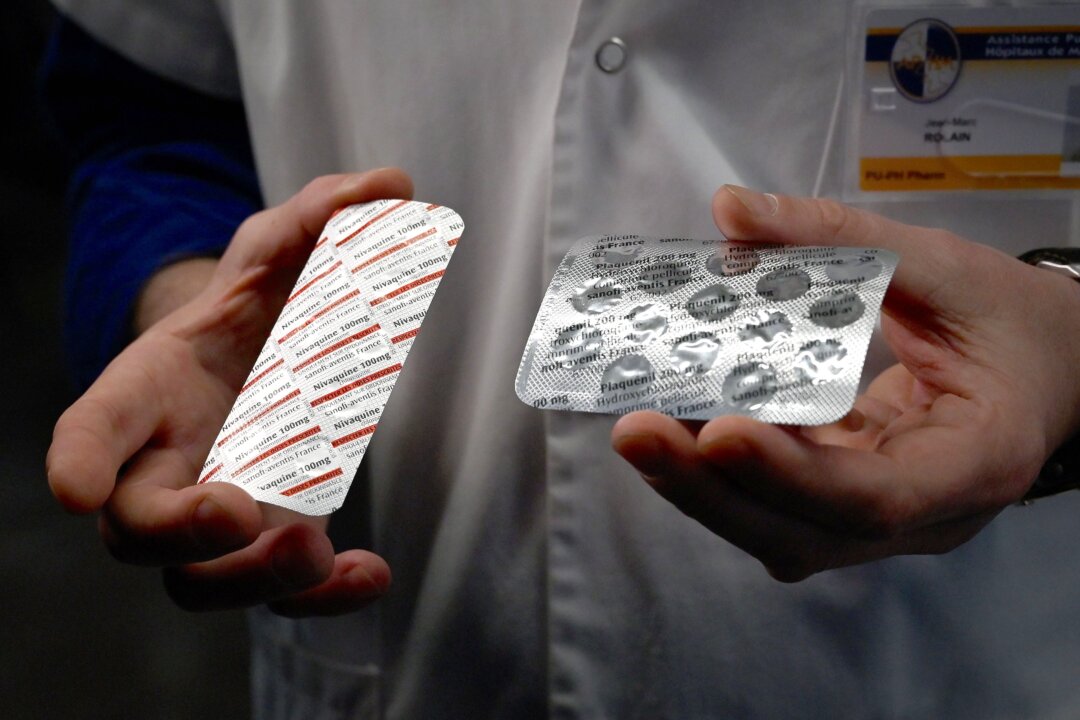 A medical staffer shows tablets containing chloroquine, a drug that has shown signs of effectiveness against the virus that causes COVID-19, in Marseille, France, on Feb. 26, 2020. (Gerard Julien/AFP/Getty Images)