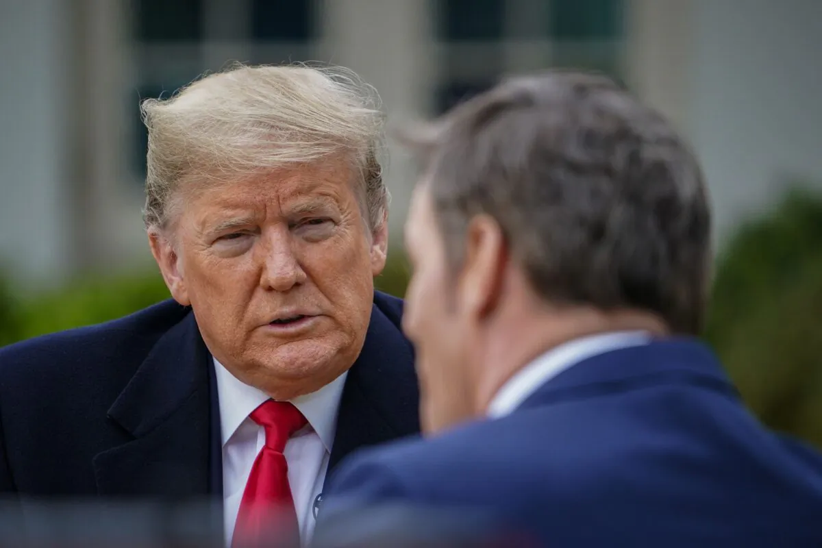 President Donald Trump (L) speaks with anchor Bill Hemmer during a Fox News virtual town hall meeting from the Rose Garden of the White House in Washington on March 24, 2020. (Mandel Ngan/AFP via Getty Images)