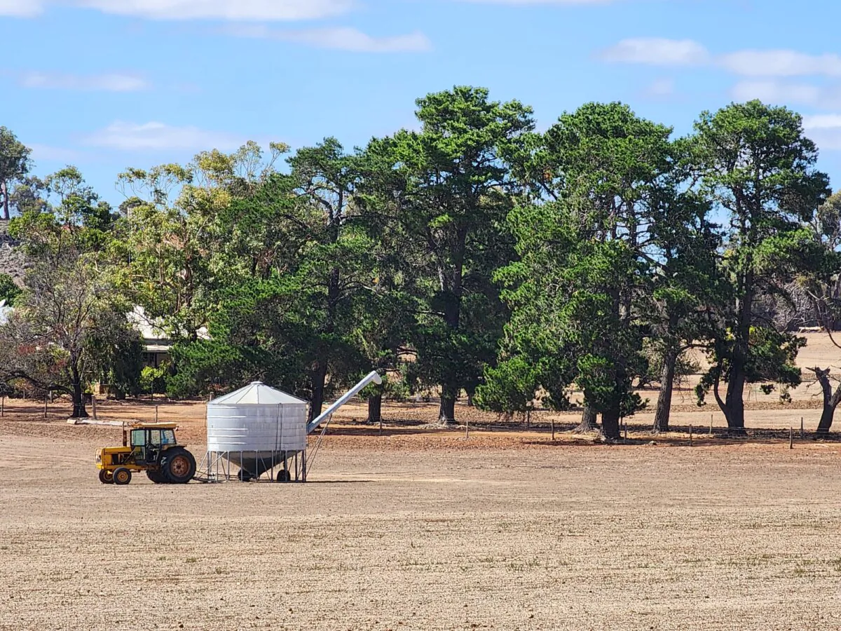 A tractor and a field bin are seen at a farm in Western Australia on March 24, 2024. (Susan Mortimer/The Epoch Times)