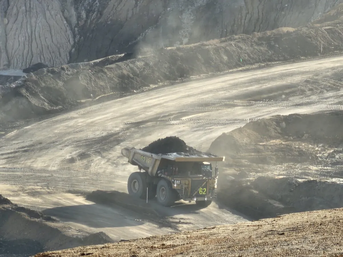A dump truck is seen transporting coal in an open cut mine owned by Premier Coal in Collie, Western Australia, on June 24, 2024. (Susan Mortimer/The Epoch Times)