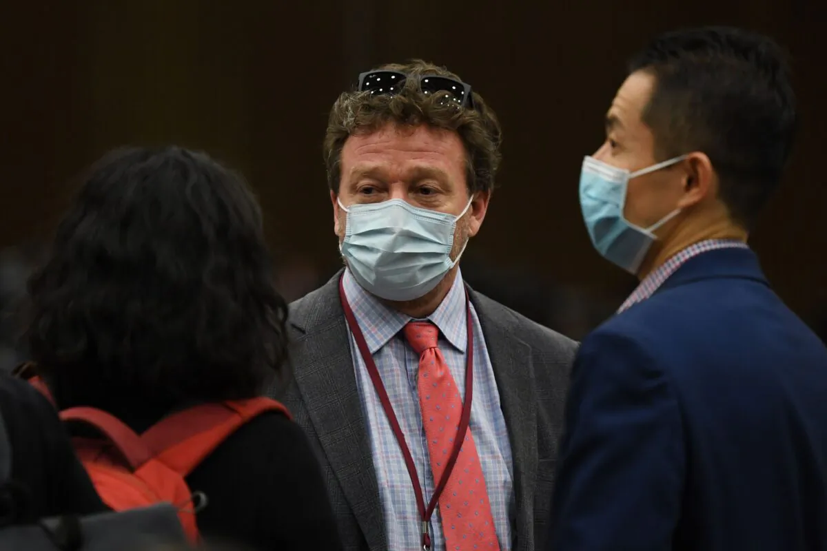 New York Times Beijing bureau chief Steven Lee Myers (C) speaks with other journalists after the daily Foreign Ministry briefing in Beijing on March 18, 2020. - China on March 18 announced it would expel American journalists from three major U.S. newspapers in one of the communist government's biggest crackdowns on the foreign press, escalating a bitter row over media freedoms. (Greg Baker/AFP via Getty Images)