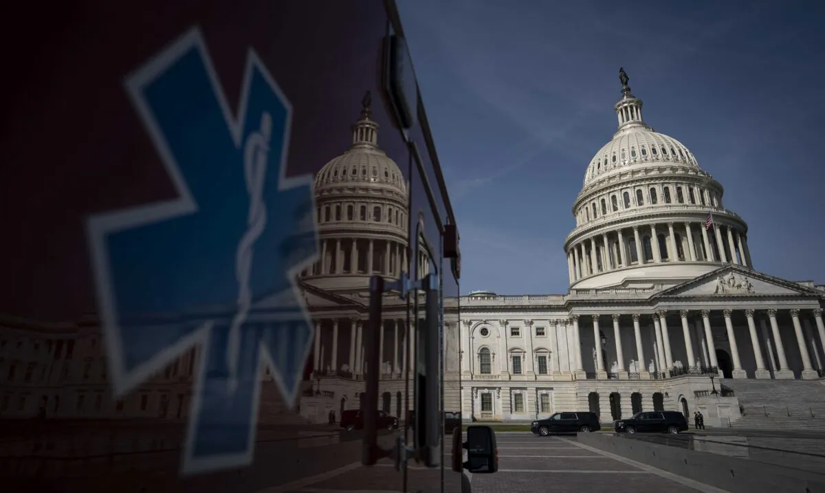 An ambulance sits parked on the plaza outside the Capitol in Washington on March 16, 2020. (Drew Angerer/Getty Images)