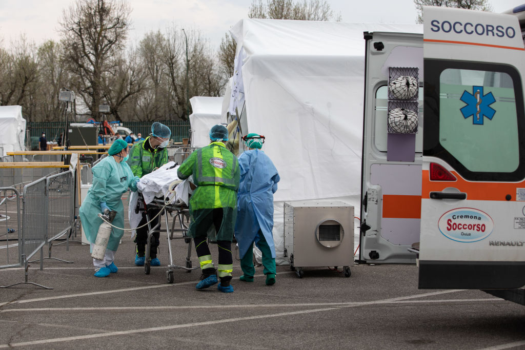 A patient is treated by a doctor at a Samaritan's Purse Emergency Field Hospital on March 20, 2020, in Cremona, near Milan, Italy. Thanks to a 68-bed respiratory unit, 32 members of Samaritan's Purse disaster response team will provide medical care during the CCP virus pandemic. (Emanuele Cremaschi/Getty Images)