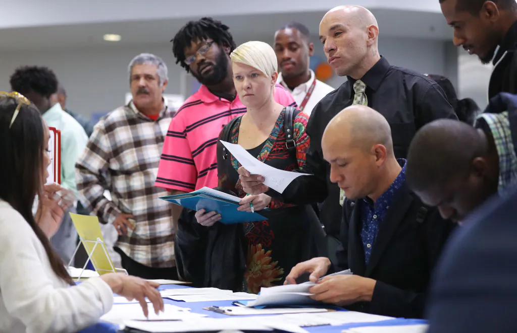 Job seekers meet with recruiters at a job fair hosted by the Los Angeles Mission on March 5, 2020 in Los Angeles. (Mario Tama/Getty Images)