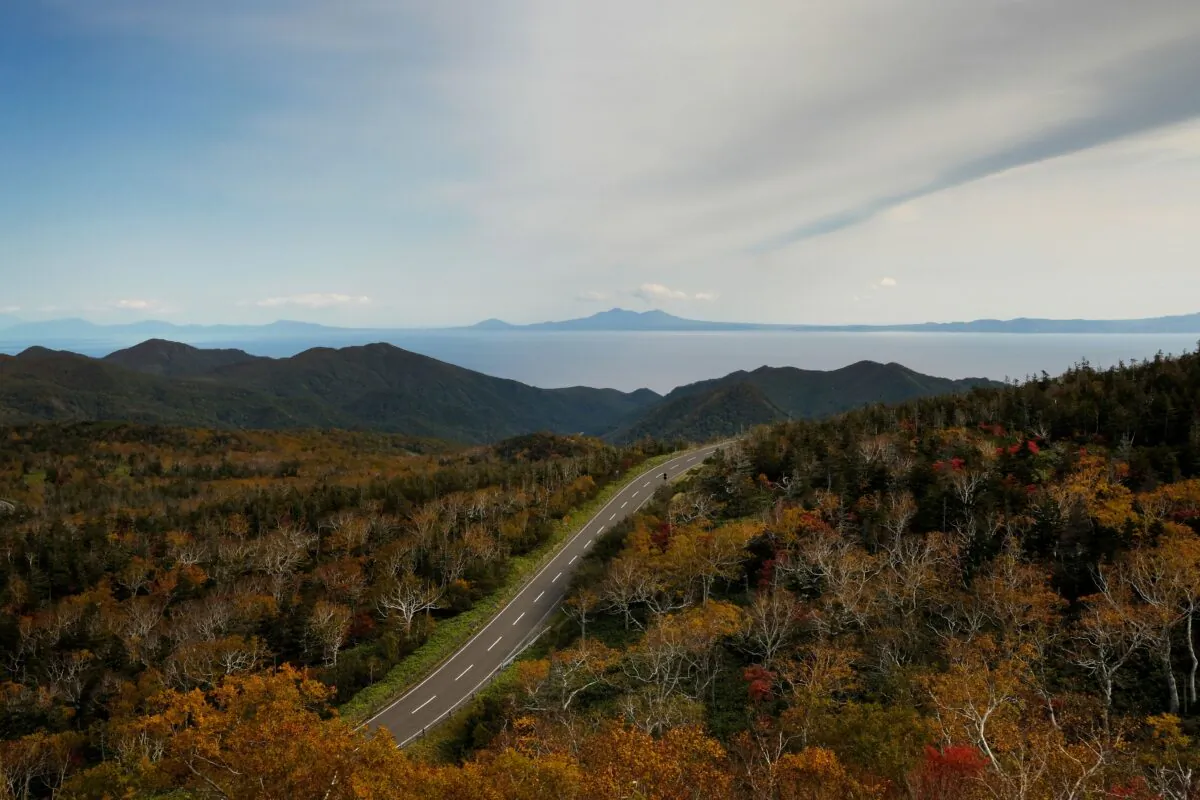 Kunashiri island (top), part of an archipelago under Russian control, as seen from a mountain pass in Rausu, Hokkaido prefecture on Oct. 10, 2018. - Four of the islands known as the Northern Territories in Japan and the southern Kuril islands in Russia. (Kazuhiro Nogi/AFP via Getty Images)