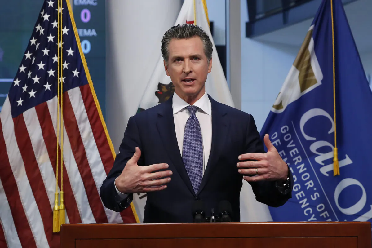 Gov. Gavin Newsom updates the state's response to the CCP virus at the Governor's Office of Emergency Services in Rancho Cordova, Calif., on March 23, 2020. (Rich Pedroncelli/Pool/AP Photo)