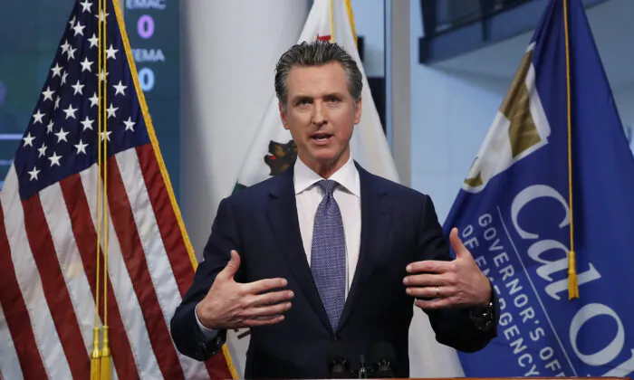 Gov. Gavin Newsom updates the state's response to the CCP virus at the Governor's Office of Emergency Services in Rancho Cordova, Calif., on March 23, 2020. (Rich Pedroncelli/Pool/AP Photo)