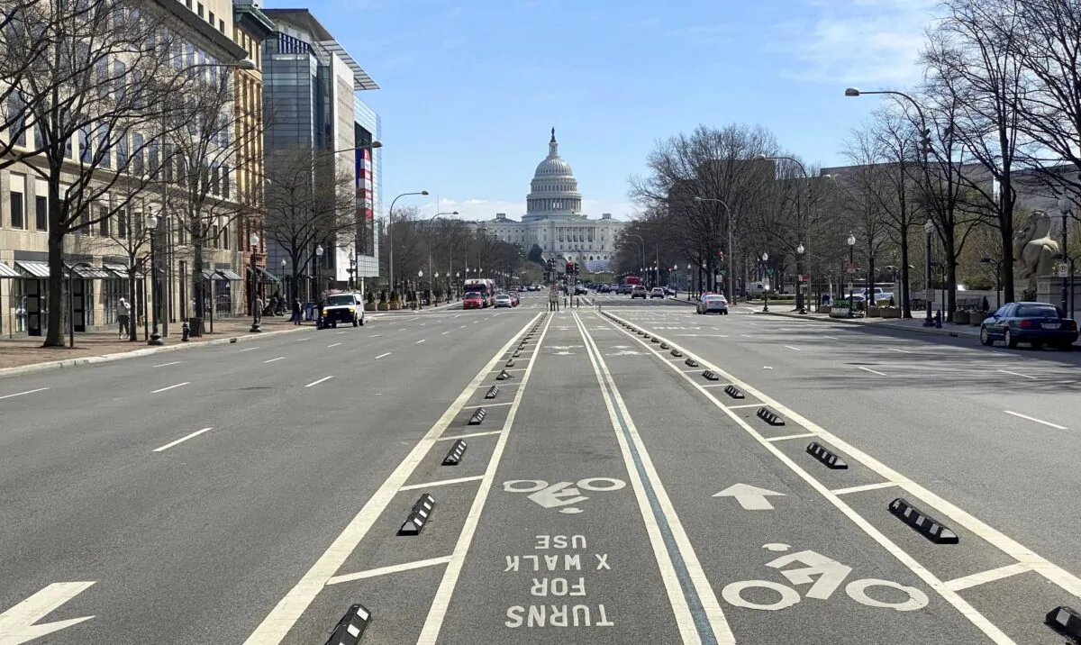 An almost empty Pennsylvania Avenue is seen at noon in Washington on March 13, 2020. (Eric Baradat/AFP via Getty Images)
