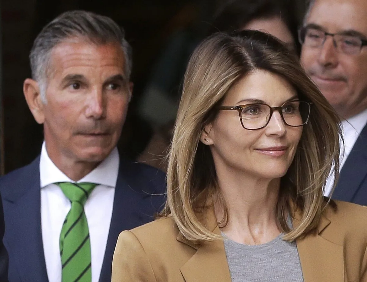 Actress Lori Loughlin, (R), and her husband, clothing designer Mossimo Giannulli (L) depart federal court in Boston, on April 3, 2019. (Steven Senne/ File/AP Photo)