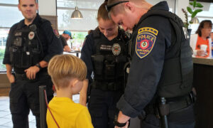 Photo of Boy Praying for Police Officers' Safety in Chick-fil-A Goes Viral on Facebook