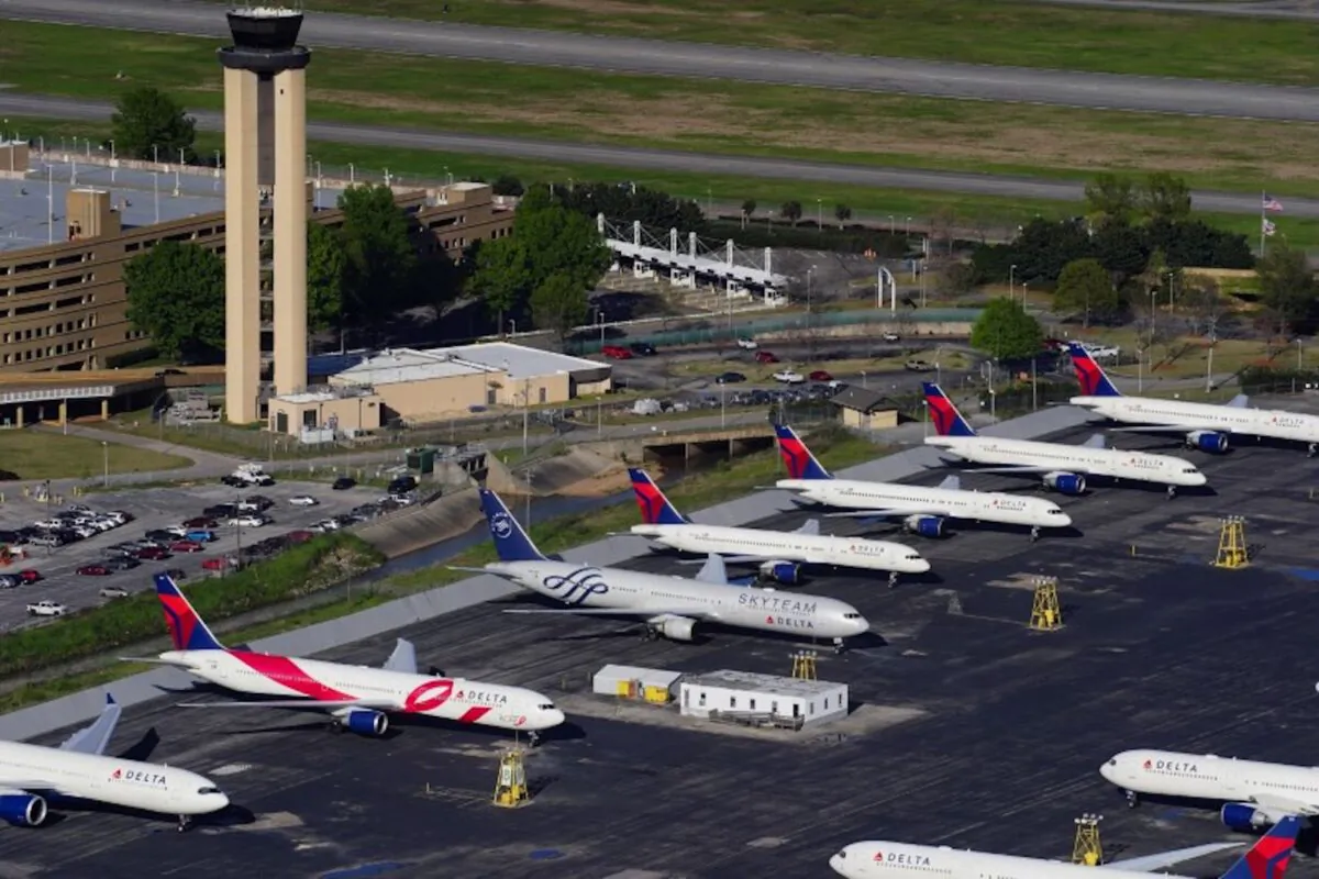 Delta Air Lines passenger planes are seen parked due to flight reductions made to slow the spread of the CCP virus (COVID-19), at Birmingham-Shuttlesworth International Airport in Birmingham, Alabama, on March 25, 2020. (Elijah Nouvelage/Reuters)