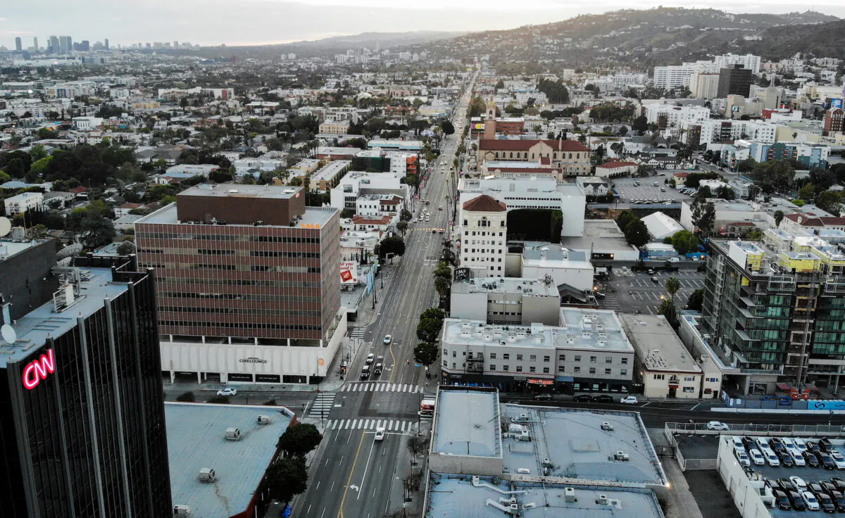 An aerial view shows Sunset Boulevard, shortly before sunset, with lighter than normal traffic amidst the CCP virus pandemic in Los Angeles, California, on March 25, 2020. (Mario Tama/Getty Images)