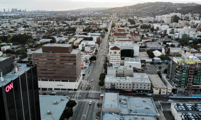 An aerial view shows Sunset Boulevard, shortly before sunset, with lighter than normal traffic amidst the CCP virus pandemic in Los Angeles, California, on March 25, 2020. (Mario Tama/Getty Images)