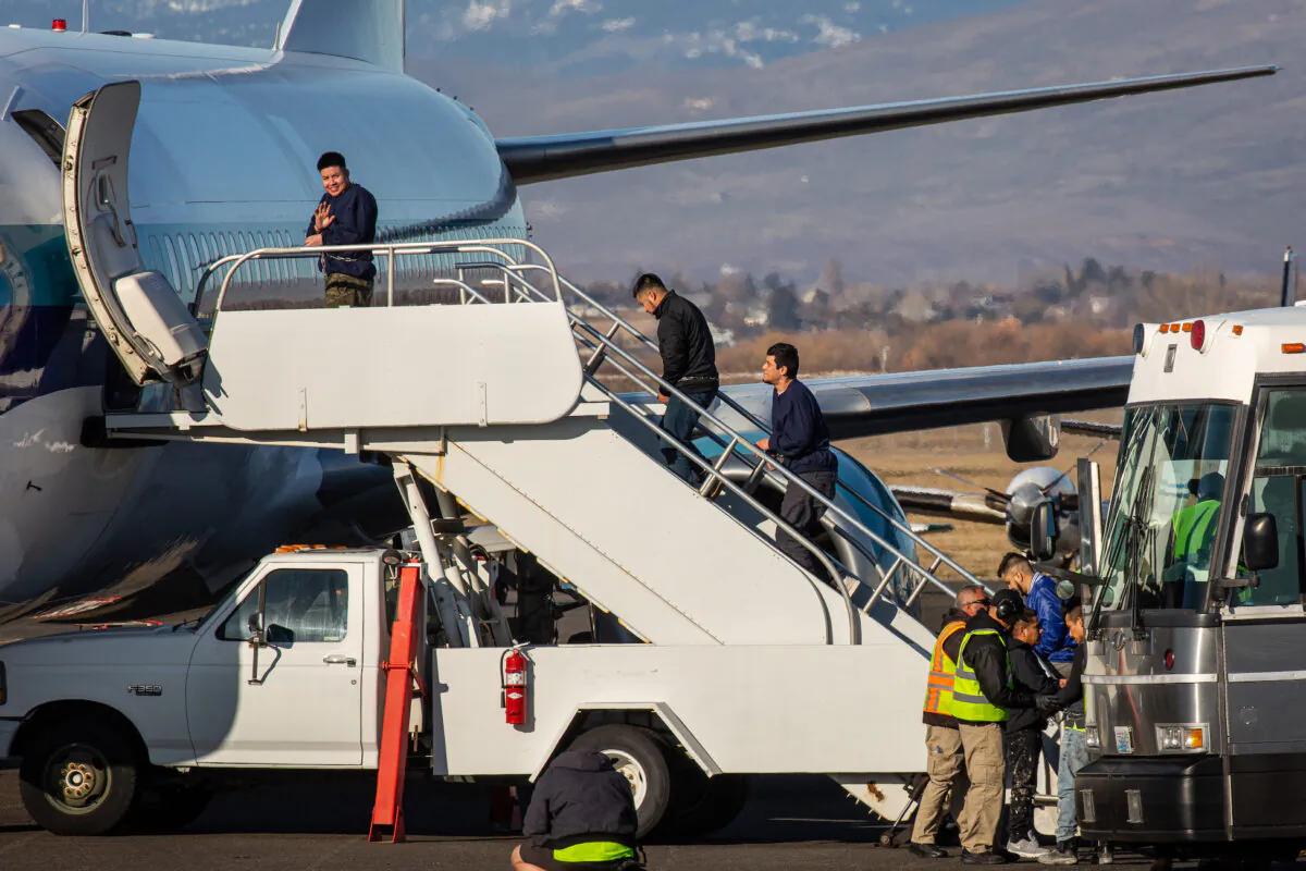 A U.S. Immigration and Customs Enforcement detainee boarding a Swift Air charter flight at McCormick Air Center on Feb. 18, 2020 in Yakima, Washington. (David Ryder/Getty Images)