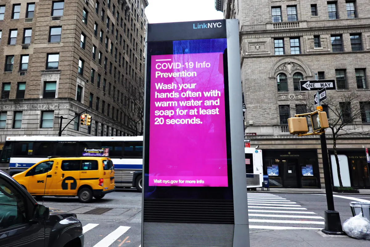 A view of a LinkNYC box with a COVID-19 Info NYC Update in New York City on March 19, 2020. (Cindy Ord/Getty Images)