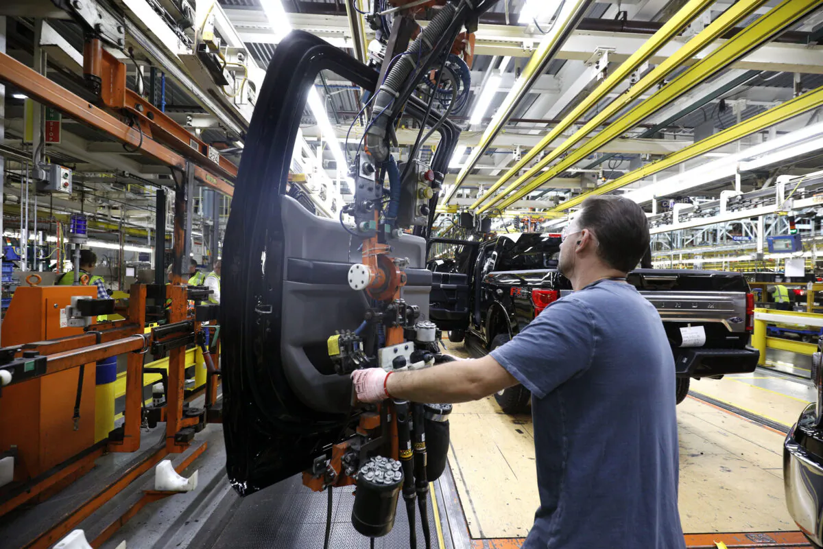 A Ford Motor Co. worker assembles an F-150 truck on the assembly line at the Ford Dearborn Truck Plant in Dearborn, Mich., on Sept. 27, 2018. (Bill Pugliano/Getty Images)