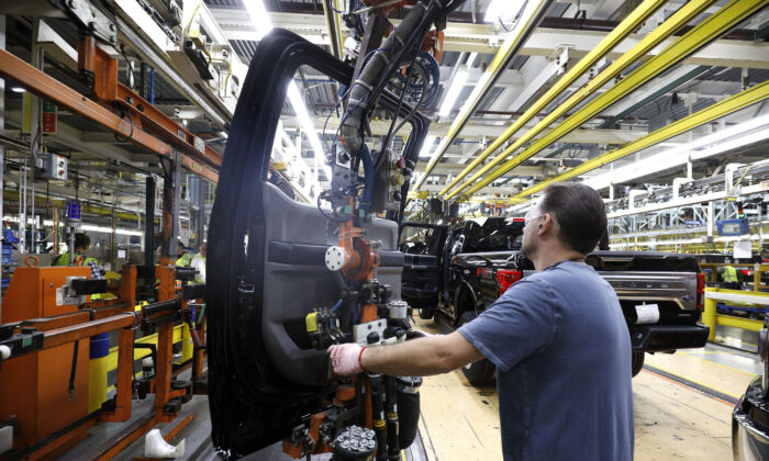 A Ford Motor Company workers works on a Ford F150 truck on the assembly line at the Ford Dearborn Truck Plant in Dearborn, Mich., on Sept. 27, 2018. (Bill Pugliano/Getty Images)
