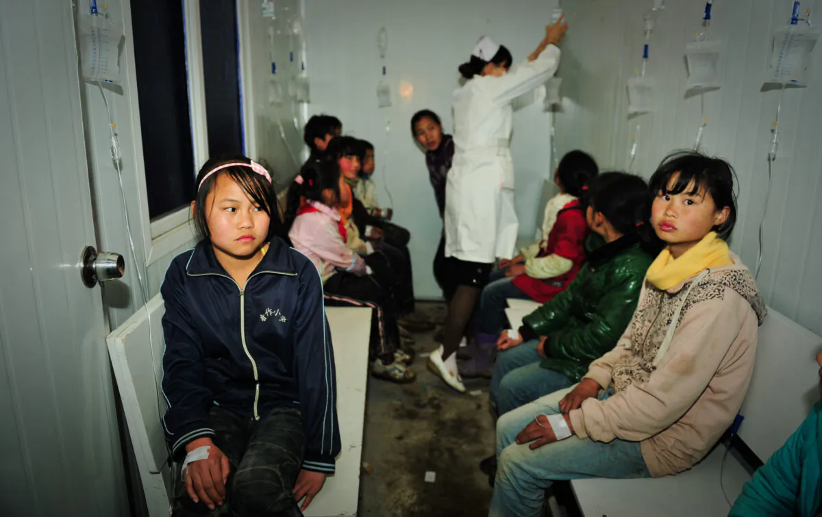 Students receive treatments at a local hospital in Zhijin County, Guizhou Province of China on March 29, 2012. (Getty Images)