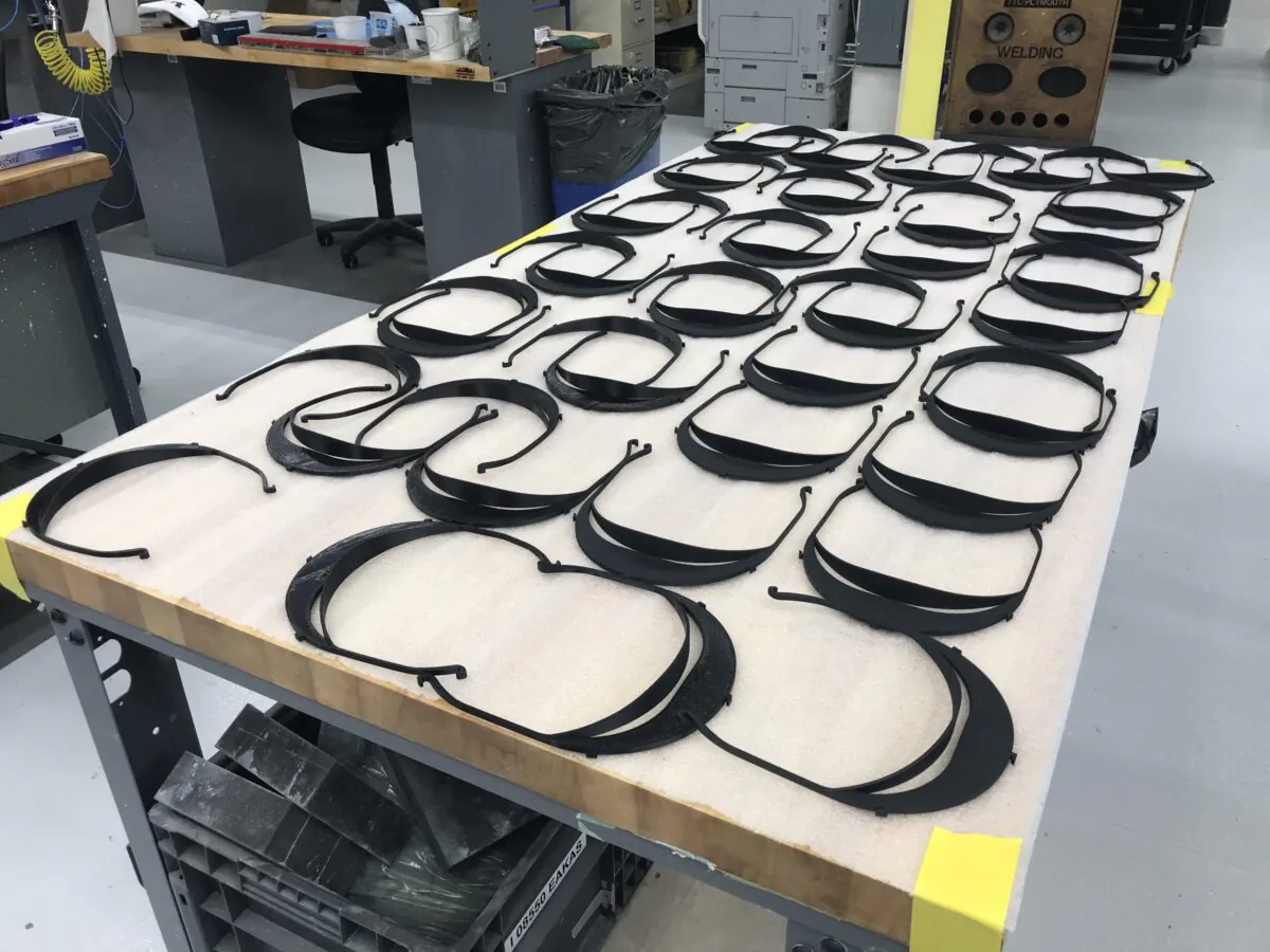 Face shield parts are laid out on a work bench in a March 27, 2020 photo provided by Toyota. (Provided by Toyota Newsroom)