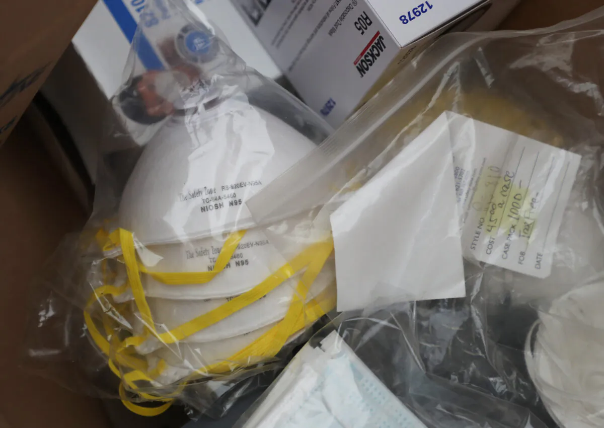 Nassau County police lead a donation drive to collect medical equipment such as N95 surgical masks, nitrile gloves, tyvex suits, antibacterial and disinfecting wipes to battle the coronavirus pandemic at Eisenhower Park in East Meadow, N.Y., on March 24, 2020. (Al Bello/Getty Images)