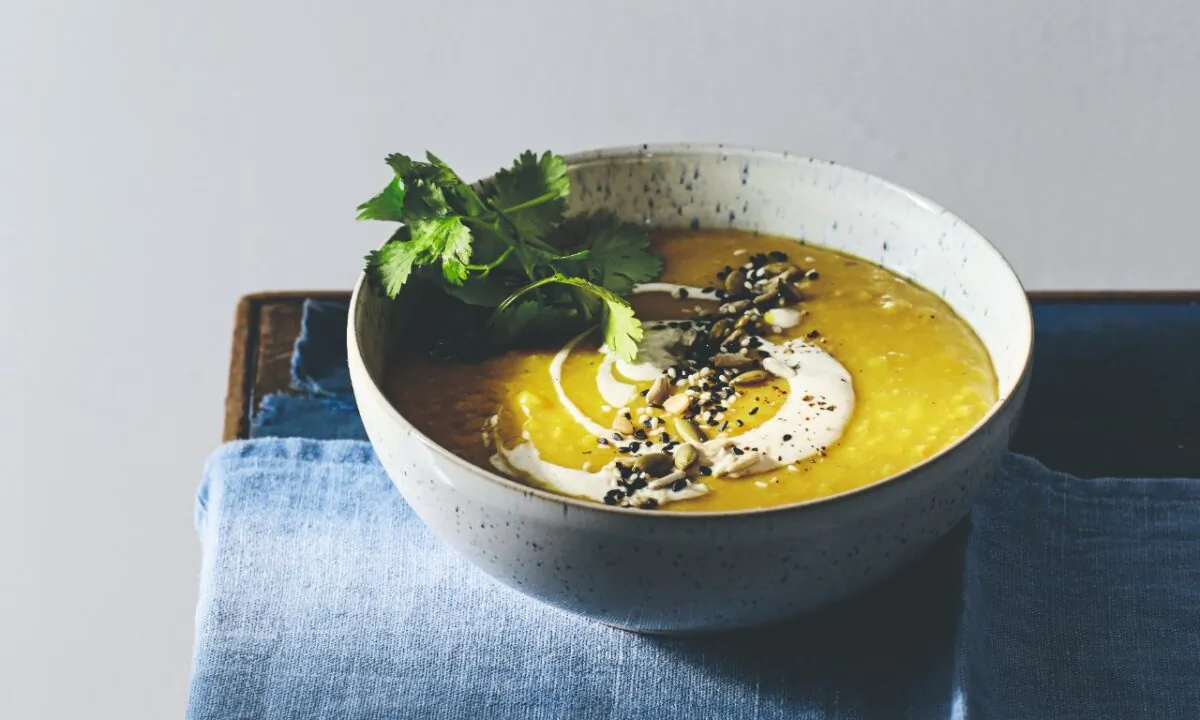Red lentil soup with turmeric, masala yogurt, toasted seeds, and cilantro. (Lizzie Mayson)