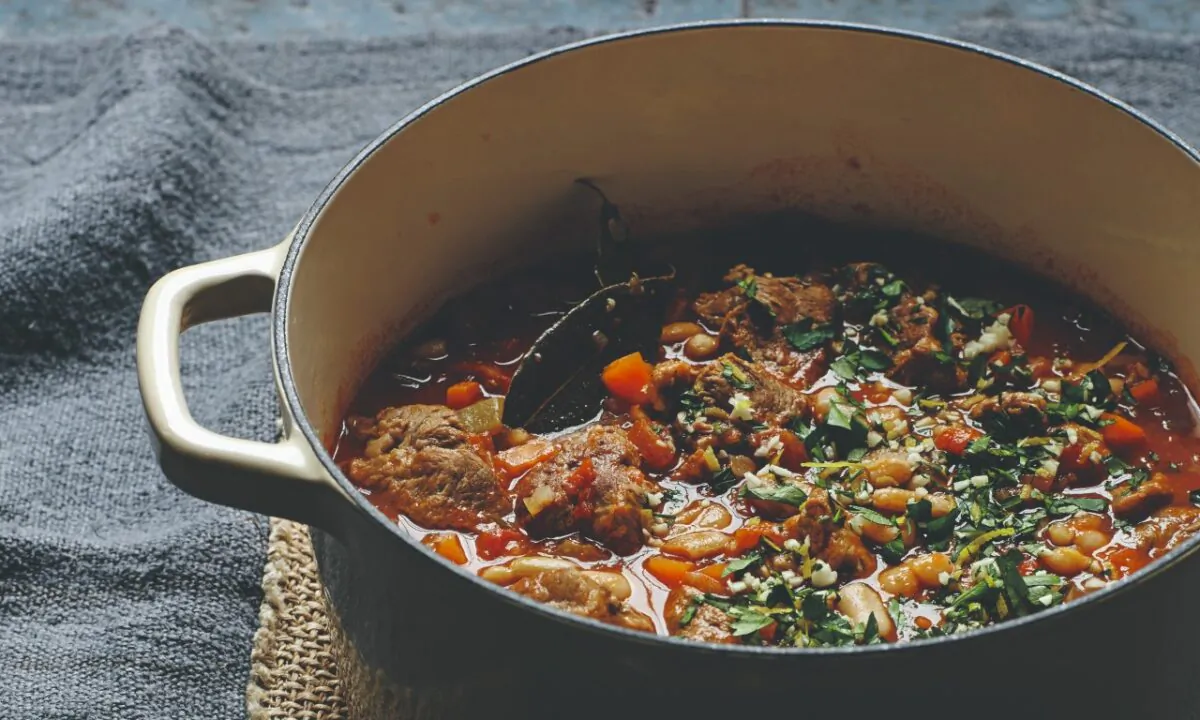 Slow-cooked lamb with cannellini beans, tomatoes, and rosemary. (Lizzie Mayson)