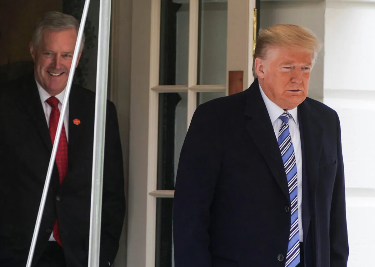 Then- President Donald Trump is followed by White House then-chief of staff Mark Meadows as he departs for a day trip to Norfolk, Virginia, from the White House in Washington, on March 28, 2020. (Reuters/Joshua Roberts)