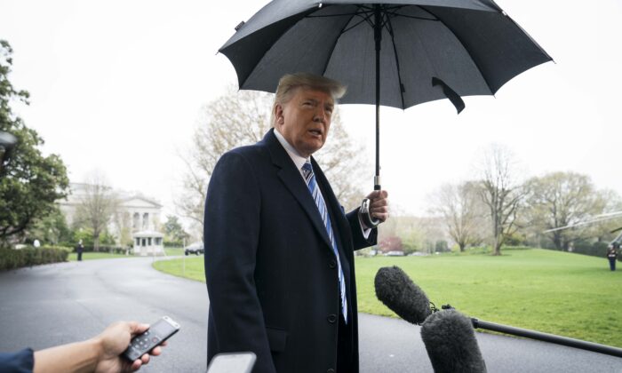 President Donald Trump speaks to a press gaggle as he departs for the Naval Station Norfolk in Norfolk, Virginia, from the White House on March 28, 2020. (Sarah Silbiger/Getty Images)
