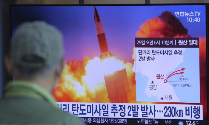 A man watches a TV screen showing a file image of North Korea's missile launch during a news program at the Seoul Railway Station in Seoul, South Korea on March 29, 2020. (Ahn Young-joon/AP Photo)