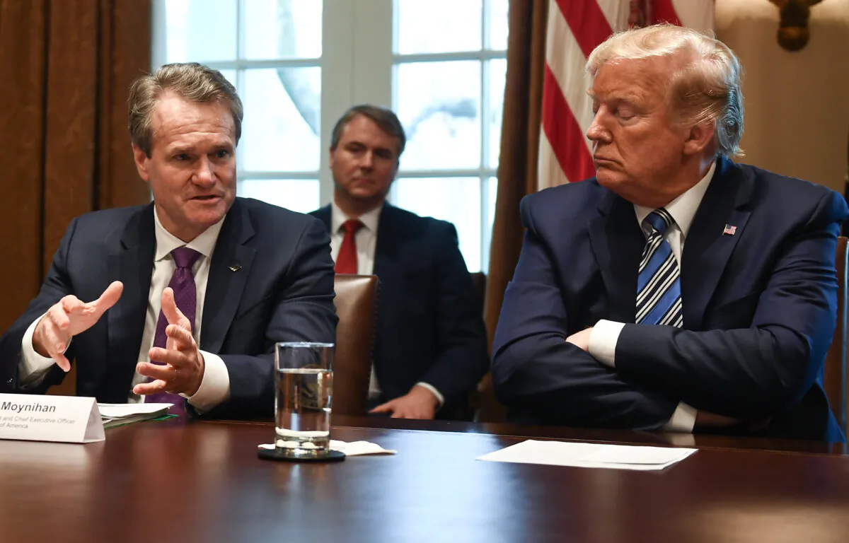 U.S. President Donald Trump gestures as CEO of Bank of America Brian Moynihan (L) speaks during a meeting with banking leaders to discuss how the financial services industry can meet the needs of customers affected by COVID-19 at the White House in Washington, DC on March 11, 2020. (Brendan Smialowski /AFP via Getty Images)