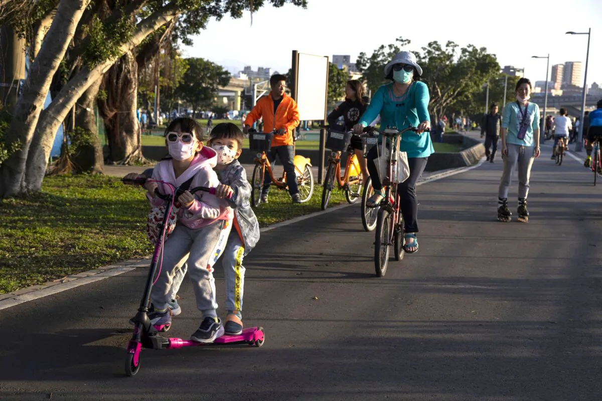 People enjoy the mild weather in Dadaocheng Park in Taipei, Taiwan, on March 15, 2020. (Paula Bronstein/Getty Images)