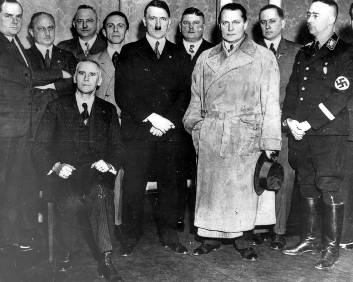 An undated photo of German dictator Adolf Hitler with his ministers at the headquarters of the National Socialists in Berlin. (Keystone/Getty Images)