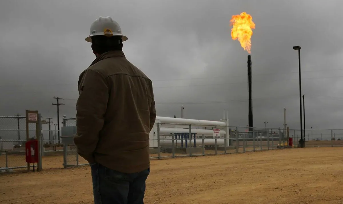 Flared natural gas is burned off at Apache Corporations operations at the Deadwood natural gas plant in the Permian Basin in Garden City, Texas, on Feb. 5, 2015. (Spencer Platt/Getty Images)