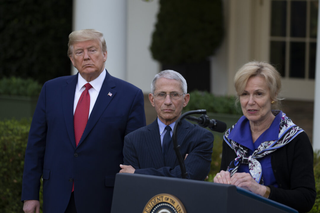Then-President Donald Trump and Dr. Anthony Fauci listen to Dr. Deborah Birx speak in the Rose Garden at the White House in Washington on March 29, 2020. (Tasos Katopodis/Getty Images)