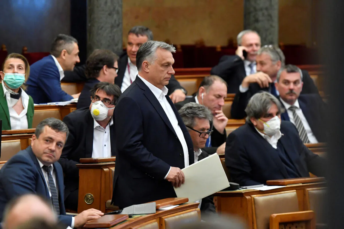 Hungarian Prime Minister Viktor Orban arrives to attend the plenary session of the Parliament ahead of a vote to grant the government special powers to combat the CCP virus disease (COVID-19) crisis in Budapest, Hungary, on March 30, 2020. (Zoltan Mathe/Pool via Reuters)