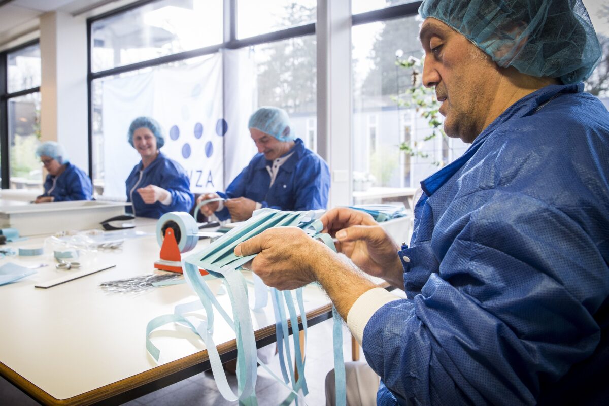 Employees make protective masks