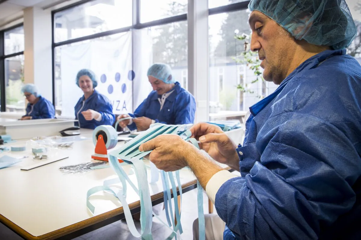 Employees make protective masks at the Wilhelmina Hospital in Assen, Netherlands, on March 20, 2020. (Vincent Jannink/ANP/AFP via Getty Images)