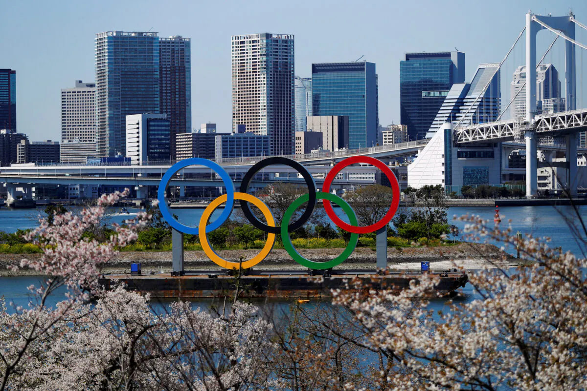 Giant Olympic rings seen at the waterfront area at Odaiba Marine Park in Tokyo, Japan, on March 25, 2020, after the announcement of the Games' postponement to 2021, due to outbreak of coronavirus disease (COVID-19). (Issei Kato/File Photo via Reuters)