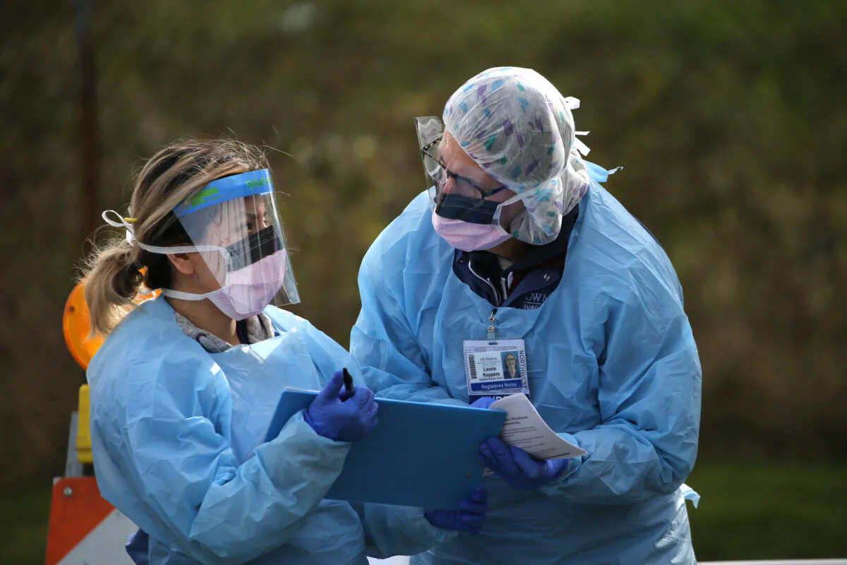 A nurse, right, and her assistant at the University of Washington medical center on March 17, 2020 in Seattle, Washington. (Karen Ducey/Getty Images)
