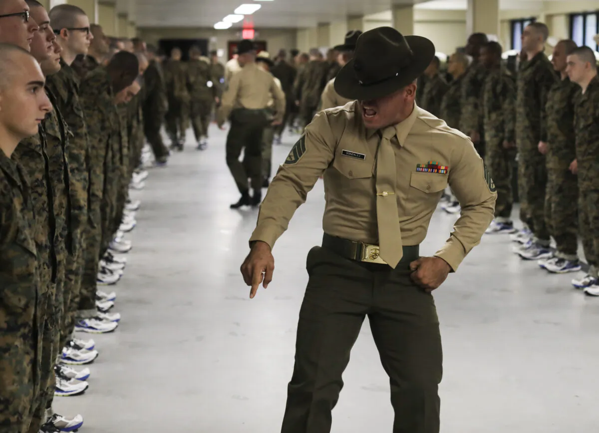 A drill instructor corrects recruits on their deficiencies on Marine Corps Recruit Depot Parris Island, S.C., on Nov. 16, 2019. (U.S. Marine Corps photo by Lance Cpl. Godfrey Ampong)