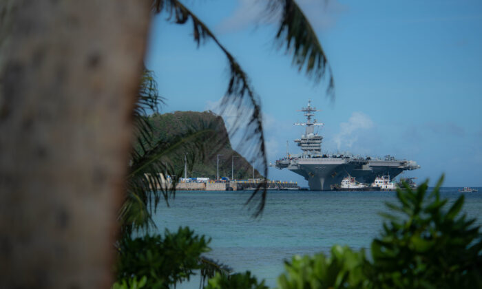 The aircraft carrier Theodore Roosevelt (CVN 71) transits Apra Harbor as the ship prepares to moor in Guam on Feb. 7, 2019.  (U.S. Navy photo by Mass Communication Specialist 3rd Class Terence Deleon Guerrero)
