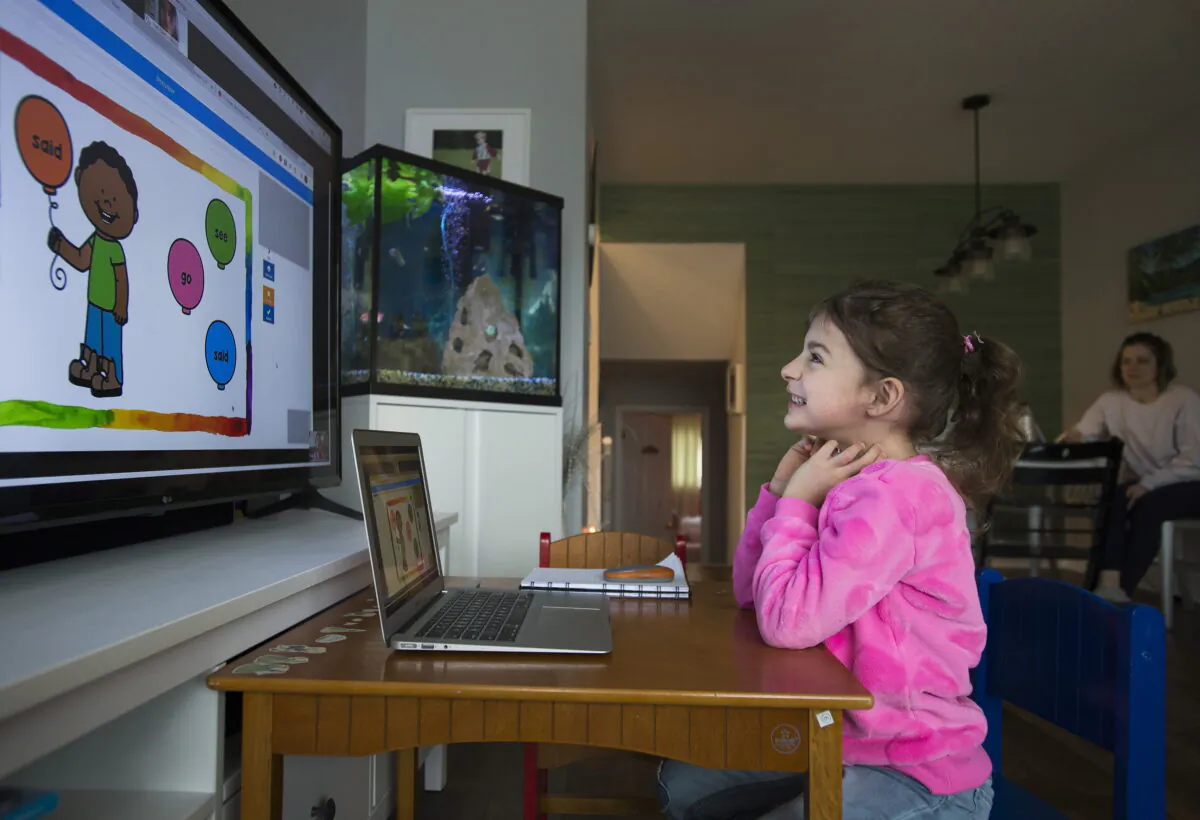 Six-year-old Peyton Denette works on her speech and language skills with speech-language pathologist Olivia Chiu of Two Can Talk remotely from her home in Mississauga, Ont., on March 30, 2020. (Nathan Denette/The Canadian Press)