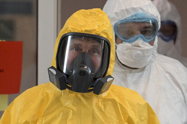 Putin wearing a protective suit