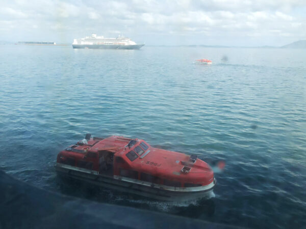 A tender approaches the Zaandam