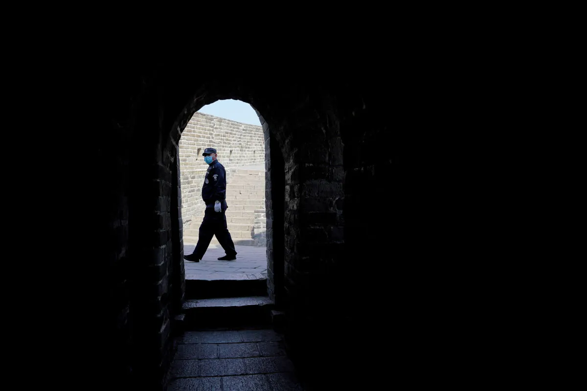 A security guard wears a protective mask at the almost empty Badaling Great Wall in Beijing, China, on March 24, 2020. Affected by COVID-19, the Badaling Great Wall was closed on Jan. 25. (Lintao Zhang/Getty Images)
