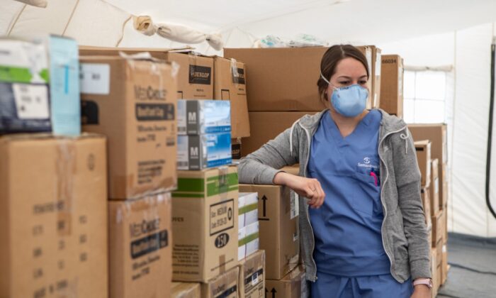 A nurse stands inside a tent with stocked medical supplies in a file photo. (Emanuele Cremaschi/Getty Images)