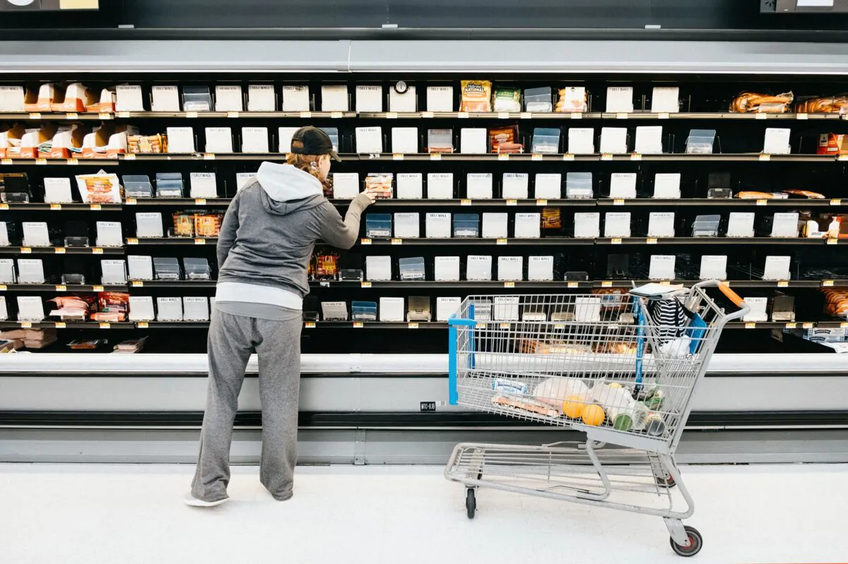 A person shops in front of the empty shelves in the deli section of Walmart Supercenter as concerns grow over the spread of CCP virus in Nashville, Tenn., on March 14, 2020. (Jason Kempin/Getty Images)