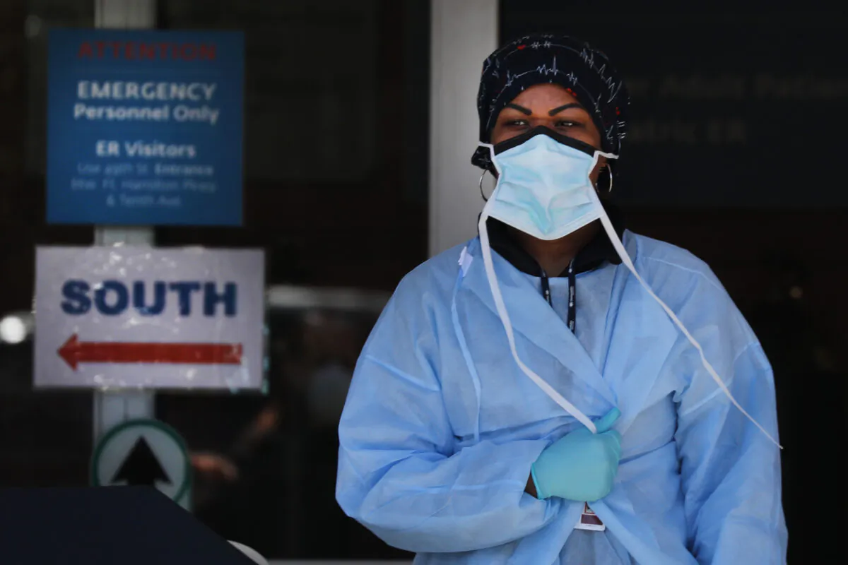 Medical workers wait for patients at a special coronavirus intake area at Maimonides Medical Center in the Brooklyn borough of New York City on April 2, 2020. (Spencer Platt/Getty Images)
