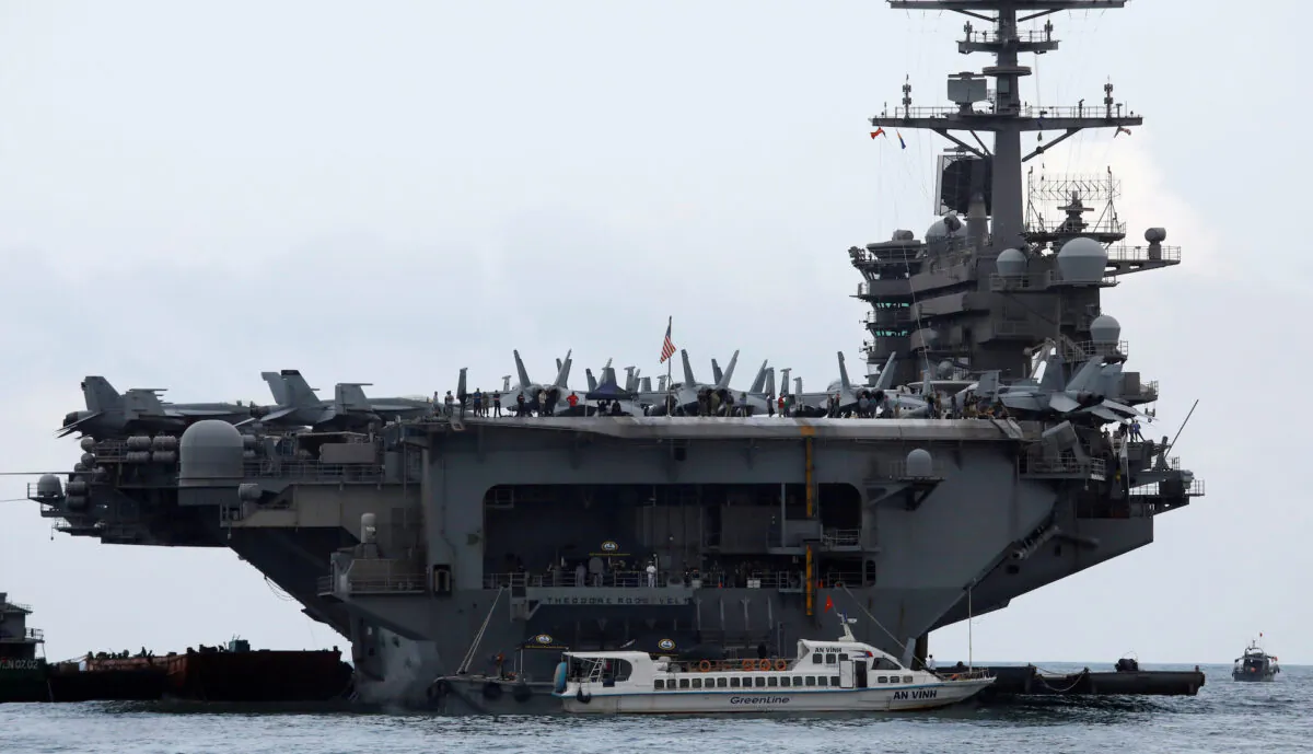 The USS Theodore Roosevelt (CVN-71) is seen while entering into the port in Da Nang, Vietnam, on March 5, 2020. (Kham/File Photo/Reuters)