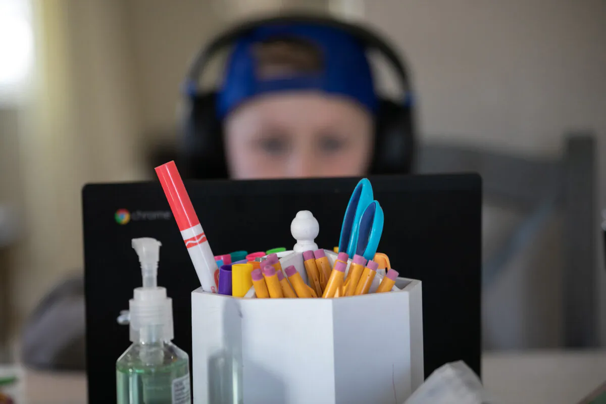 A student works on a home schooling project in New Rochelle, New York, on March 18, 2020. (John Moore/Getty Images)